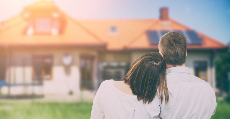 Young couple looking at dream house.