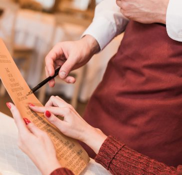 customer asking waiter about menu